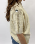 Maglia morbida con gioiello