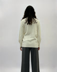 Pullover dolcevita ampio con gioielli