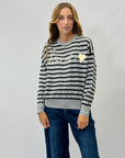 Pullover a righe con scritta love
