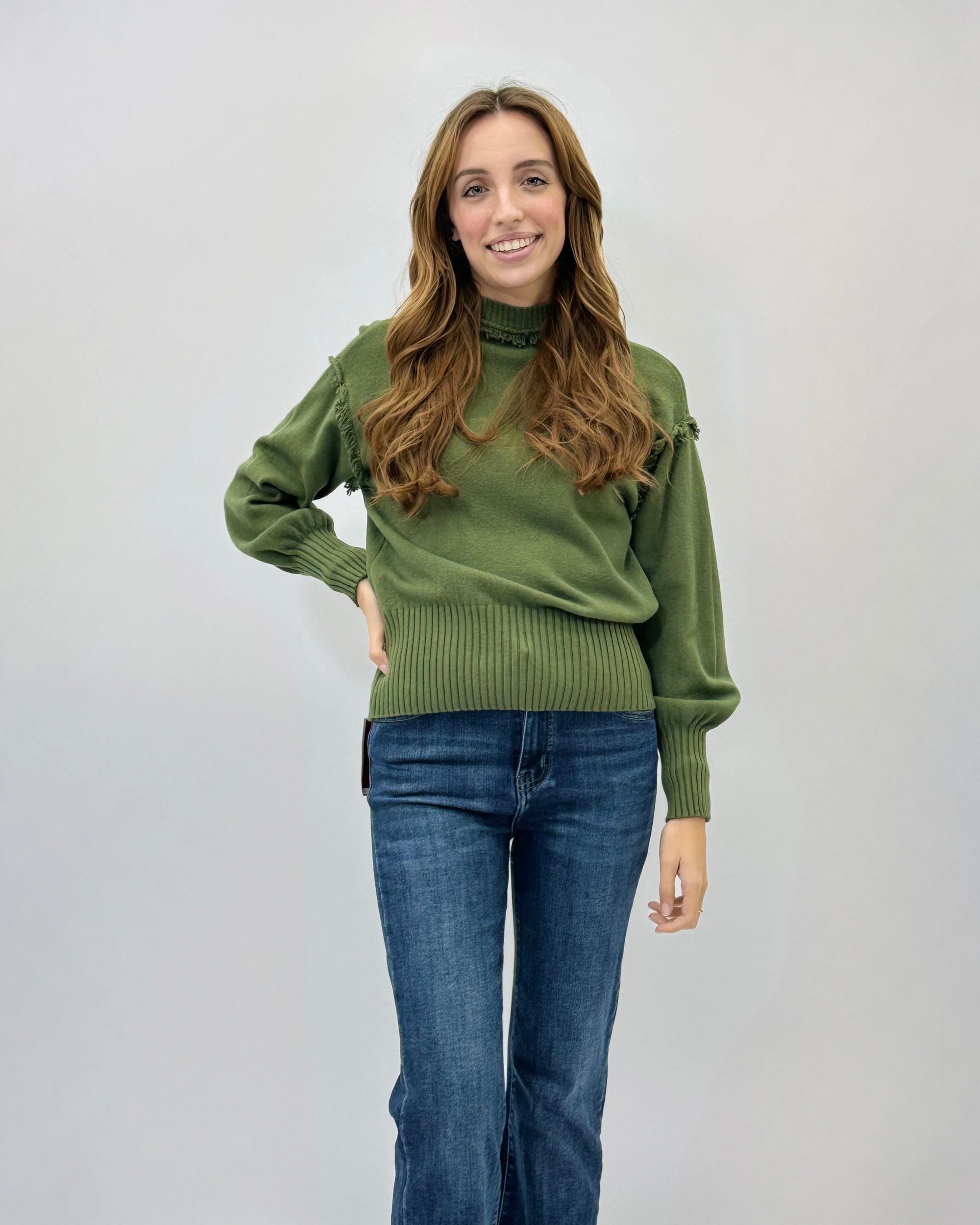 Maglione lupetto con dettagli frange