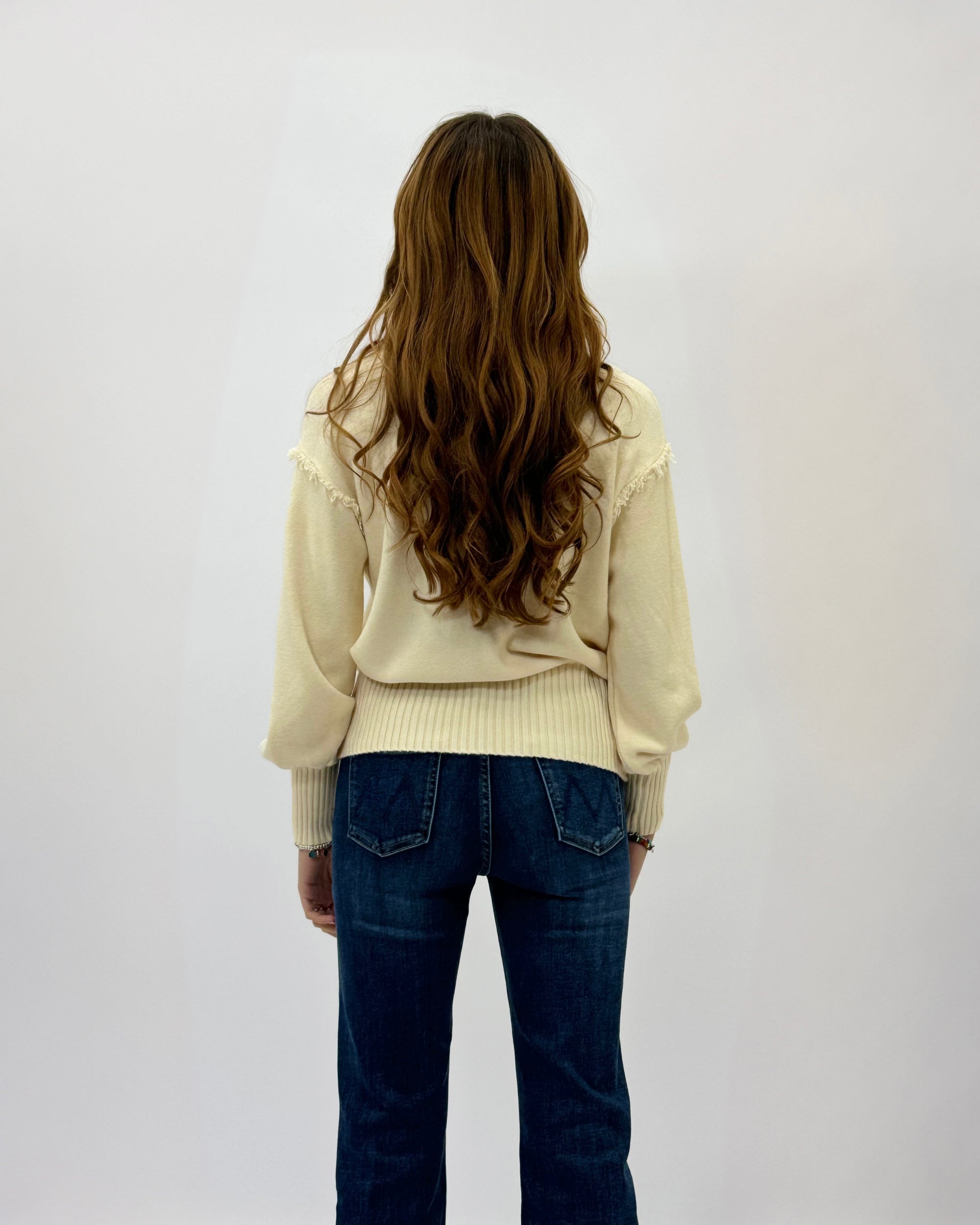 Maglione lupetto con dettagli frange