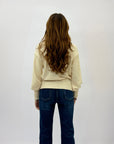 Maglione lupetto con dettagli frange