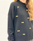 Pullover fiocchietti ricamati