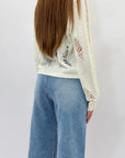 Jeans con bottoni e tasche