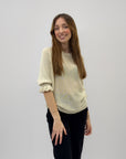 Maglia con manica volant e fiocco