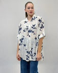 Camicia in pizzo con dettaglio fiori