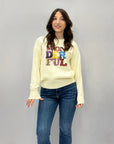 Maglione scritta wonderful in paillettes