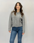 Maglia con zip dettaglio perle
