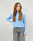 Maglione morbido con intrecci e rotture