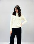 Pullover tinta unita con bottoni laterali