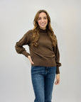 Maglione lupetto con dettagli frange