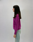 Maglione dolcevita con tre intrecci