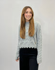 Maglione morbido con intrecci e rotture