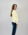 Maglione lupetto con dettagli frange