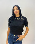 Maglia intrecciata con dettagli gioielli
