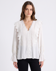 Camicia elegante con pizzo e scollo a V