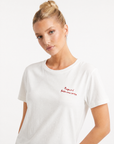 T-shirt bianca con scritta “Raga si è fatta una certa”