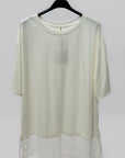 T-shirt over con inserto in pizzo sul fondo