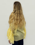Blusa leggera a righe con maniche ampie a balze