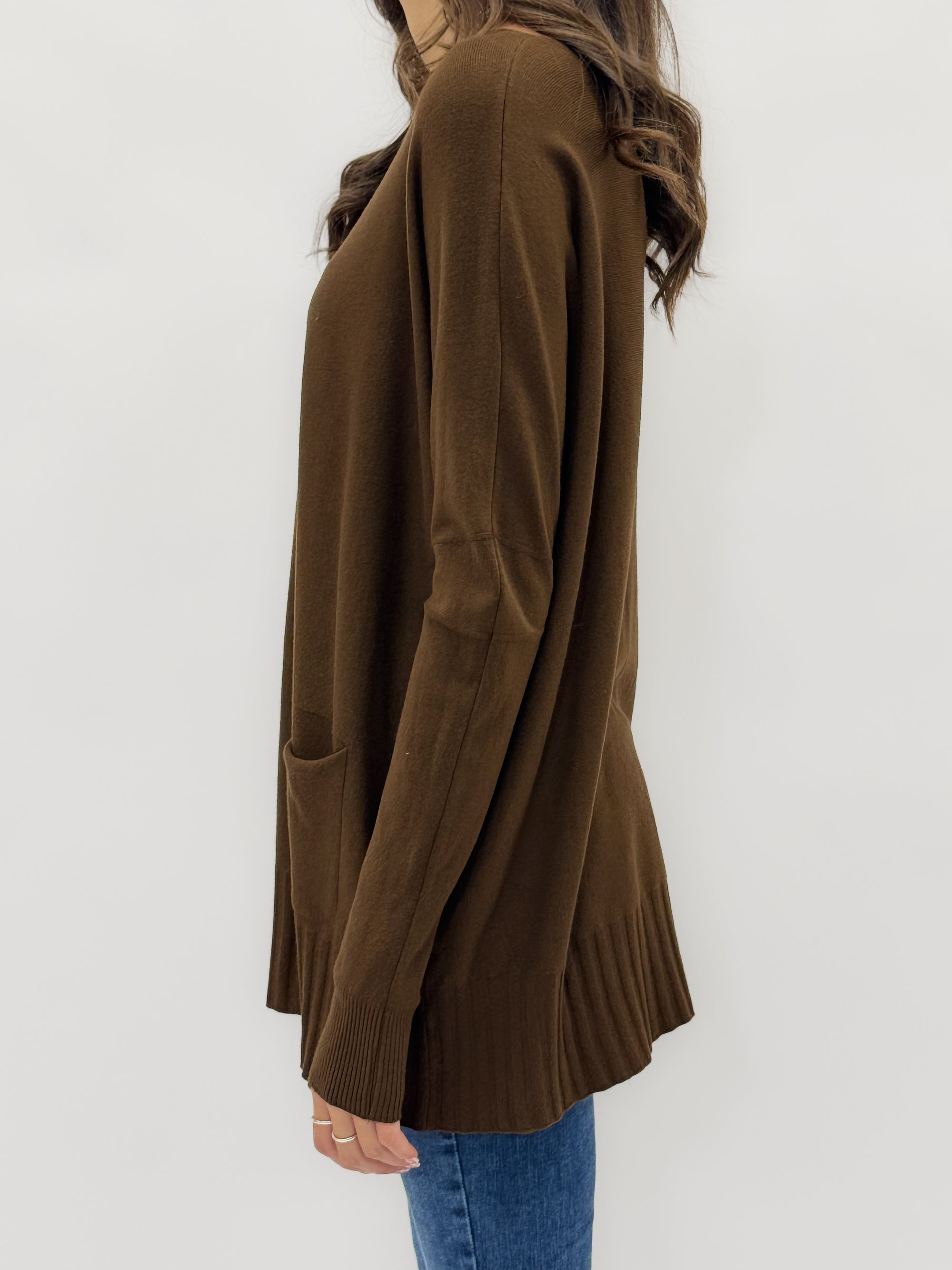 Maglione lungo con tasche frontali