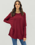 Maglione lungo con tasche frontali