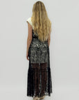 Abito lungo in pizzo trasparente effetto layering elegante
