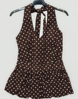 Top a pois con scollo all’americana e balza