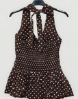 Top a pois con scollo all’americana e balza