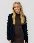 Cardigan morbido con applicazioni in rilievo