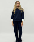 Completo in tessuto tecnico con felpa oversize e pantalone palazzo