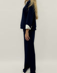 Completo in tessuto tecnico con felpa oversize e pantalone palazzo