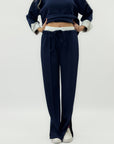 Completo in tessuto tecnico con felpa oversize e pantalone palazzo