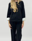 Completo in tessuto tecnico con felpa oversize e pantalone palazzo