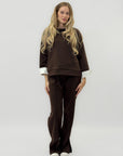 Completo in tessuto tecnico con felpa oversize e pantalone palazzo