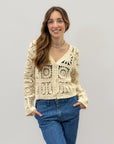 Maglia crochet con bottoni