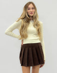 Gonna corta in suede plissettata – Stile chic e femminile