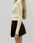 Maglione trecce a girocollo – Classico e femminile