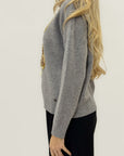 Maglione morbido con orsetto ricamato
