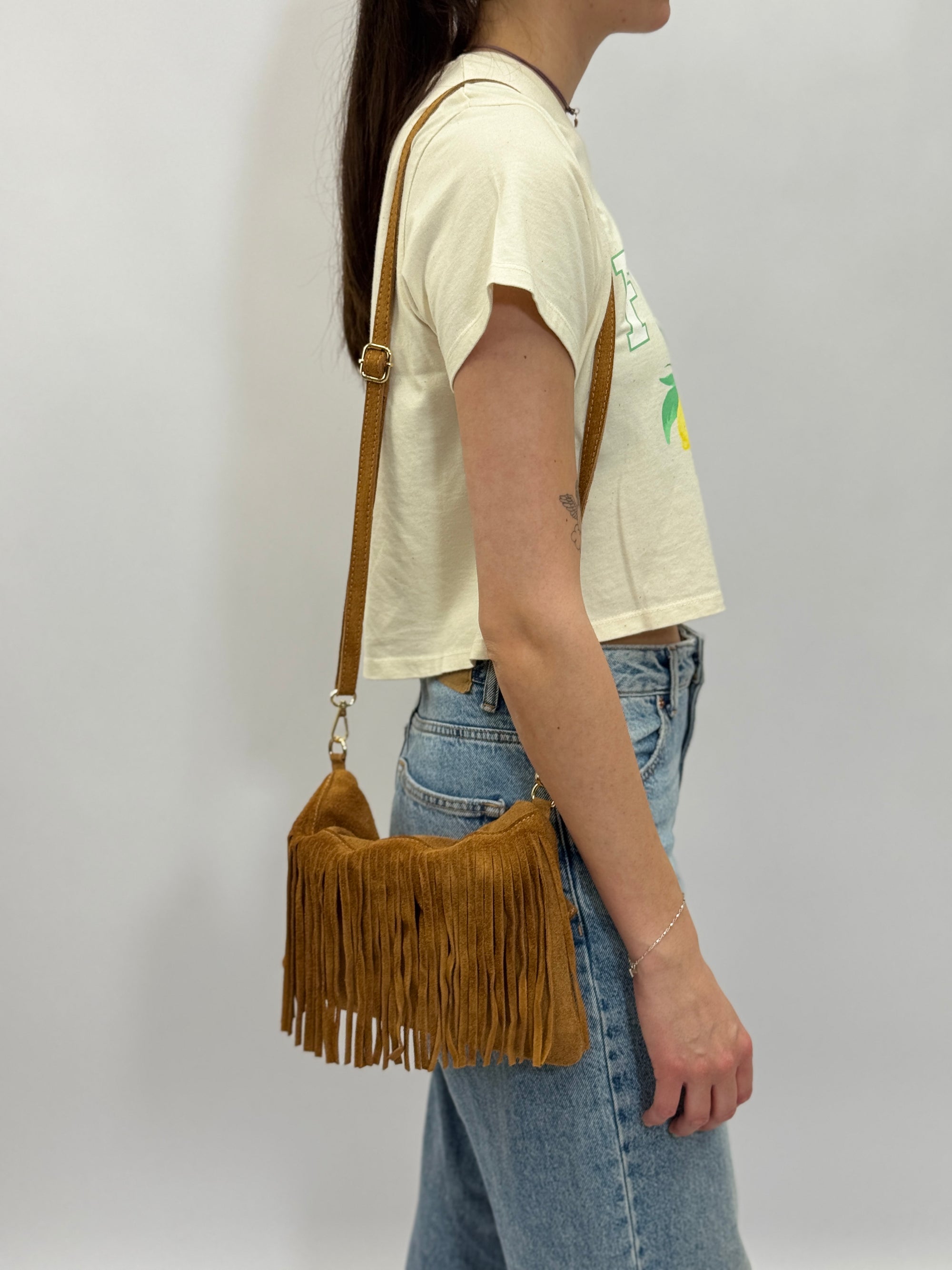 Borsa con manico rigido e frange in vera pelle