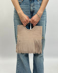 Borsa con manico rigido e frange in vera pelle
