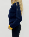 Cardigan con colletto e polsini volant – Dettagli raffinati per un tocco bon ton