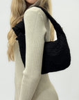 Borsa hobo intrecciata in suede