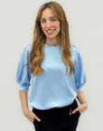 Blusa con maniche a sbuffo
