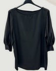 Blusa con maniche a sbuffo