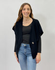 Maglia asimmetrica con bottone