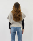 Maglia asimmetrica con bottone