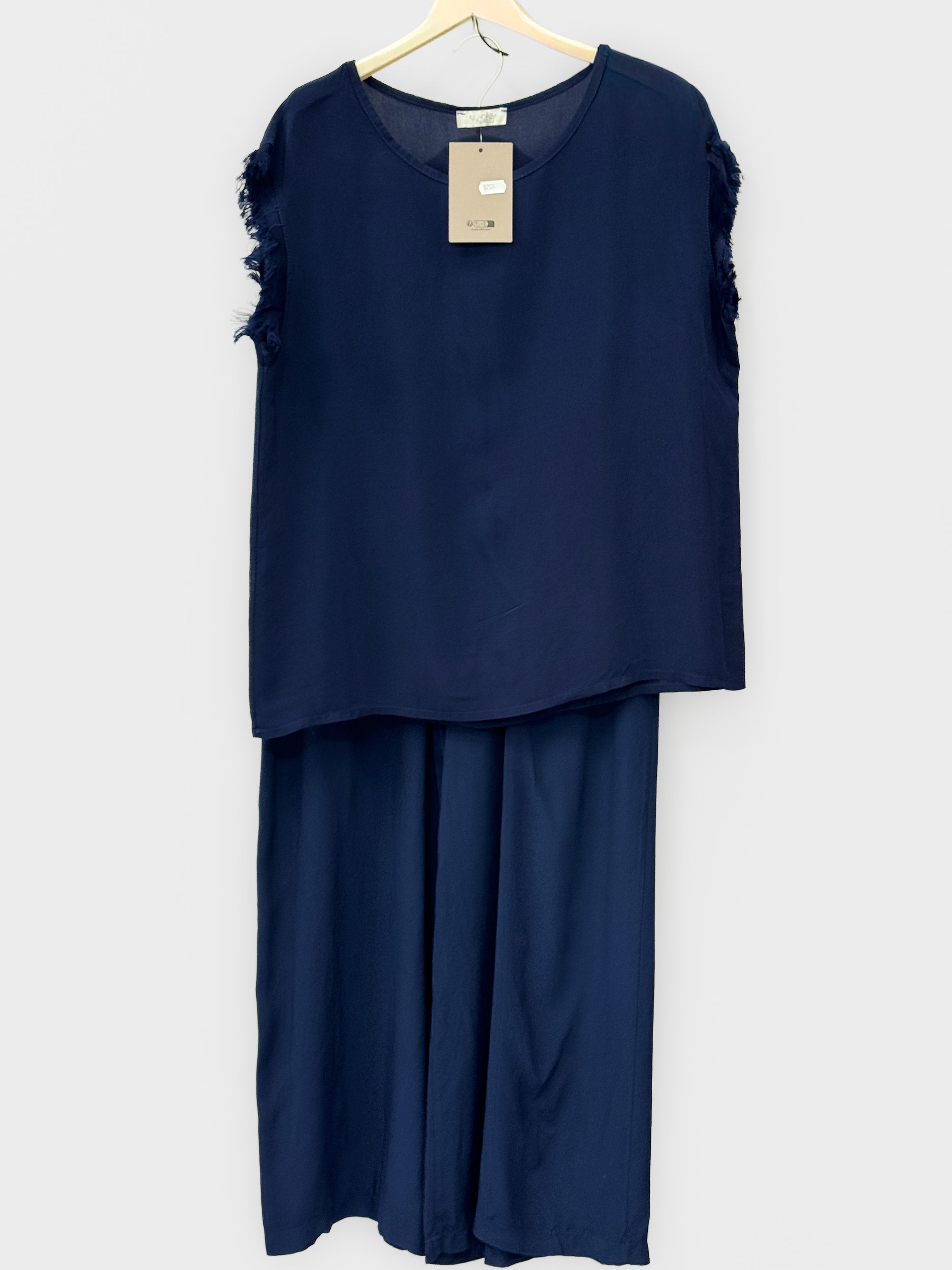 Completo top sfrangiato e pantalone palazzo
