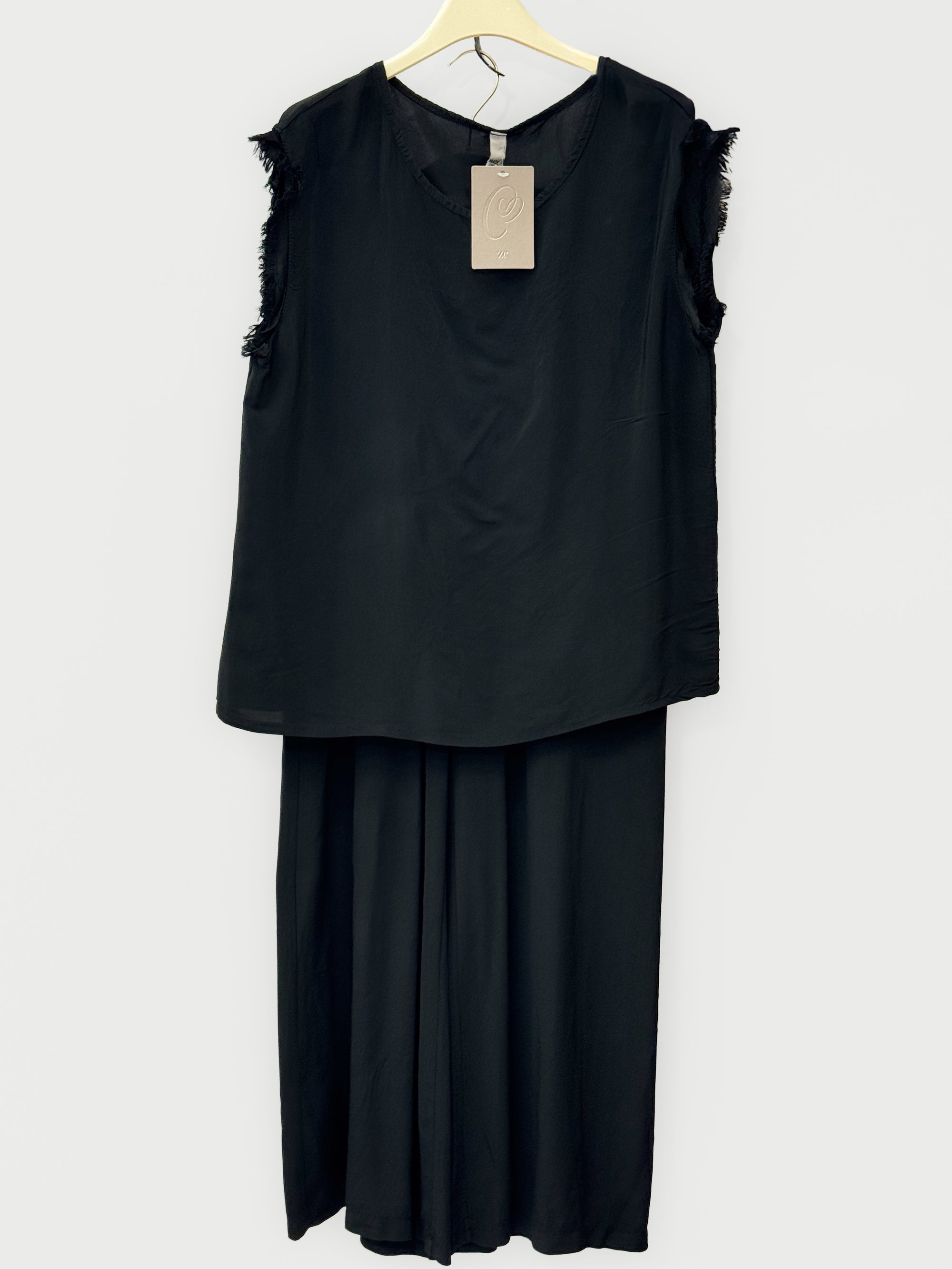 Completo top sfrangiato e pantalone palazzo