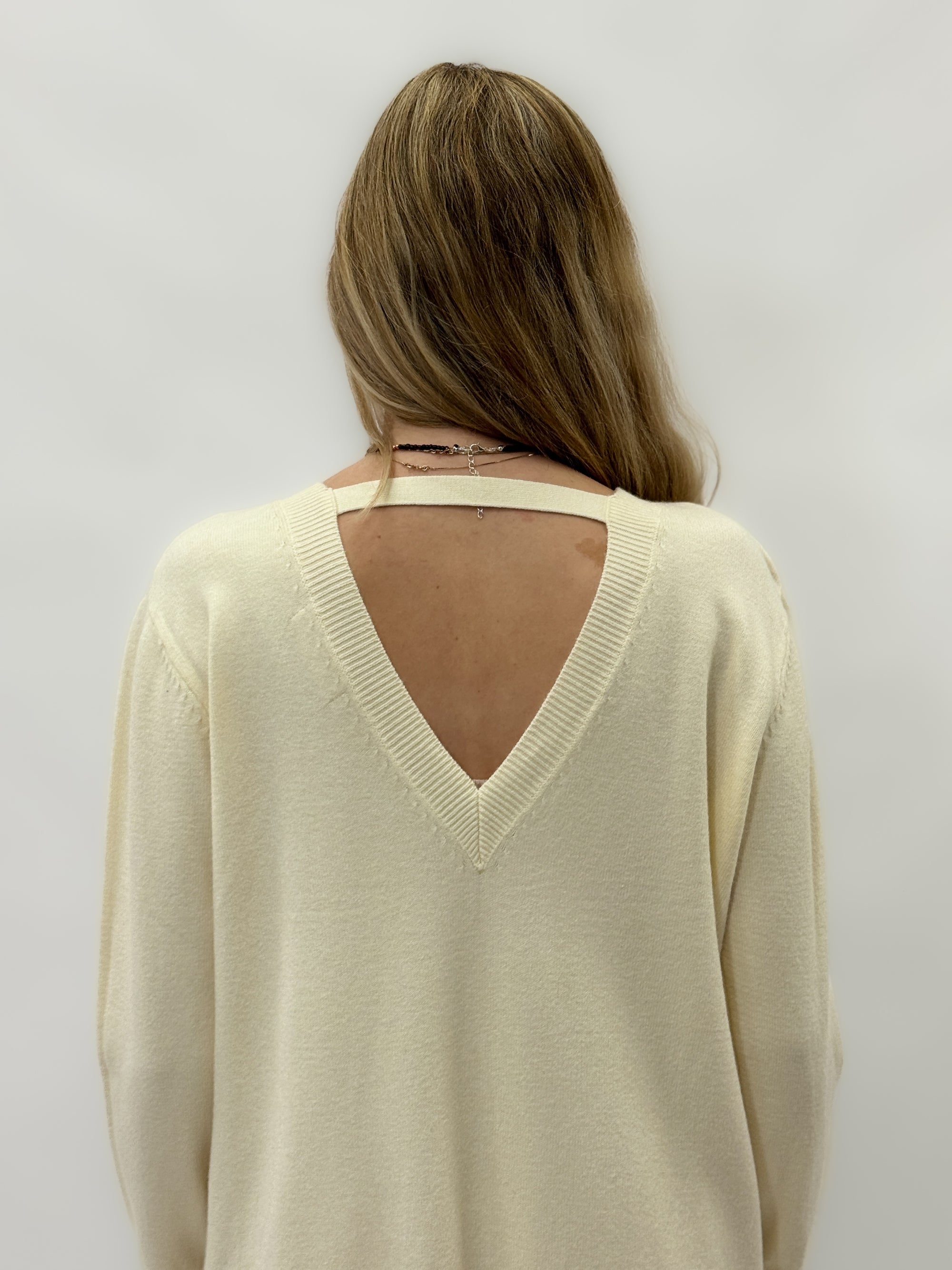 Abito in maglia con scollo a V sulla schiena