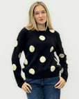 Maglione nero a pois bianchi – Stile moderno e morbida eleganza